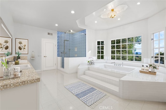 bathroom featuring vanity, tile patterned floors, and independent shower and bath