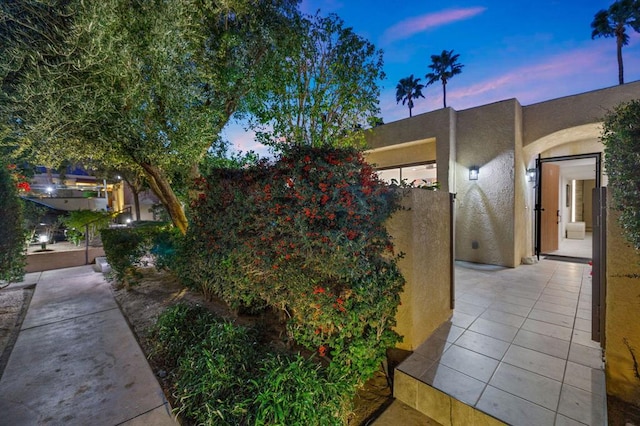 view of property exterior at dusk