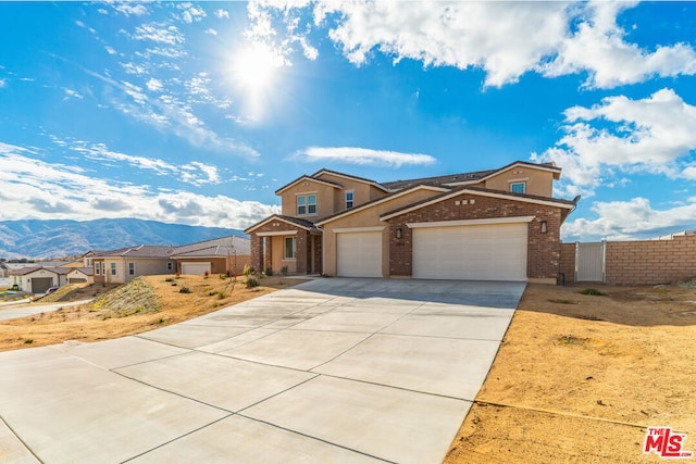 view of front of house with a mountain view and a garage