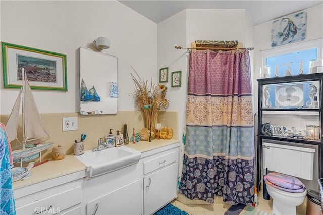 bathroom featuring vanity, tile patterned floors, a shower with curtain, toilet, and decorative backsplash