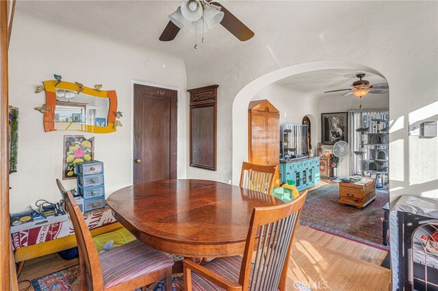 dining space featuring ceiling fan and hardwood / wood-style flooring