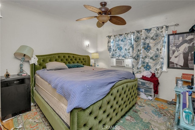 bedroom featuring ceiling fan and cooling unit