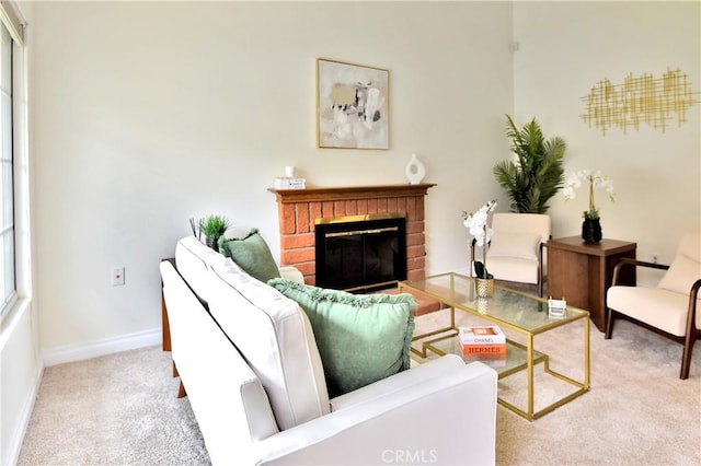 carpeted living room featuring a brick fireplace