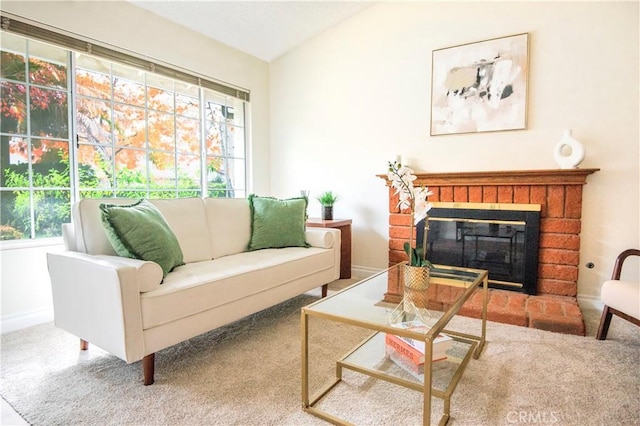 sitting room with carpet flooring and a brick fireplace