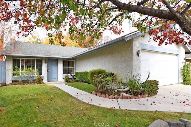 ranch-style home featuring a garage and a front yard