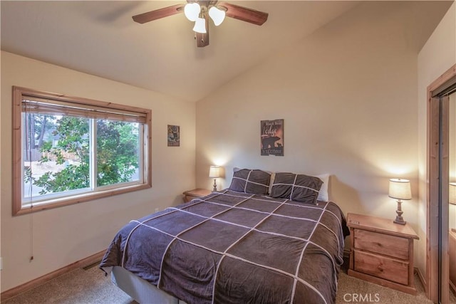 bedroom with lofted ceiling, carpet, baseboards, and a ceiling fan