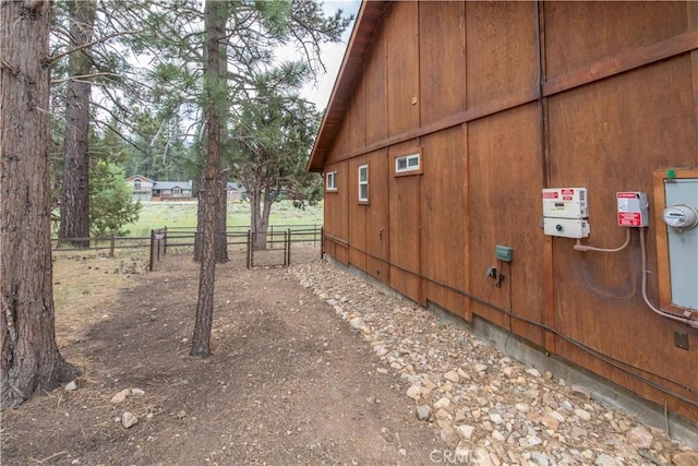 view of property exterior with fence