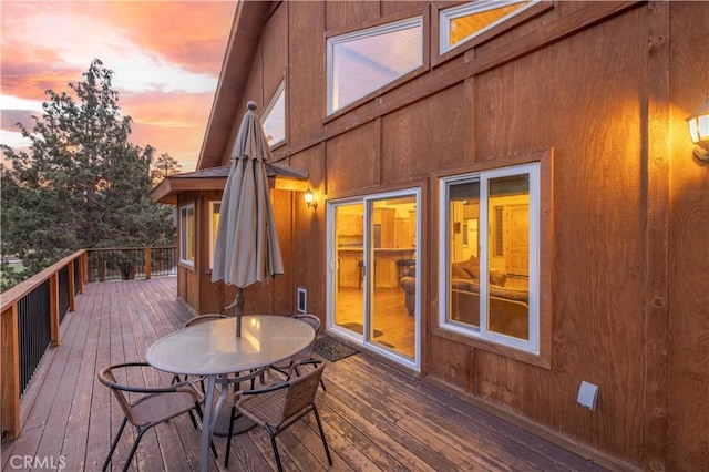 wooden deck with outdoor dining area