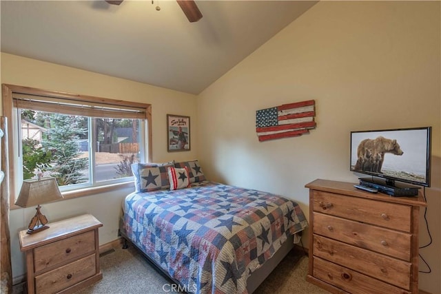 bedroom with ceiling fan, carpet, and vaulted ceiling