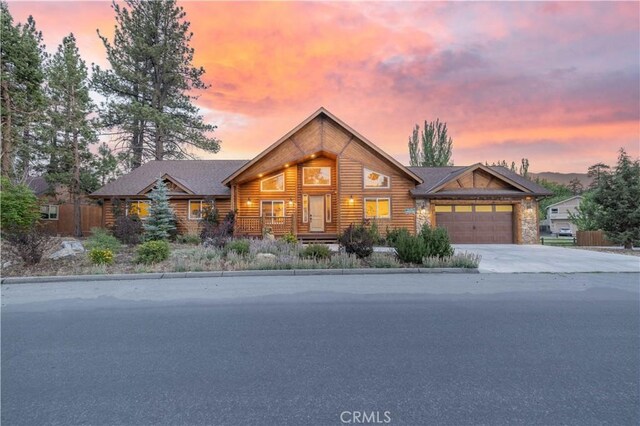 log cabin featuring a garage