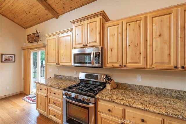 kitchen featuring vaulted ceiling with beams, light hardwood / wood-style floors, light brown cabinetry, wood ceiling, and appliances with stainless steel finishes