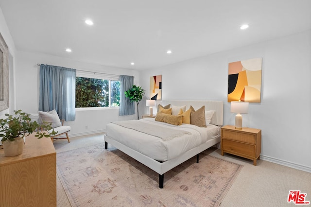 bedroom with light colored carpet