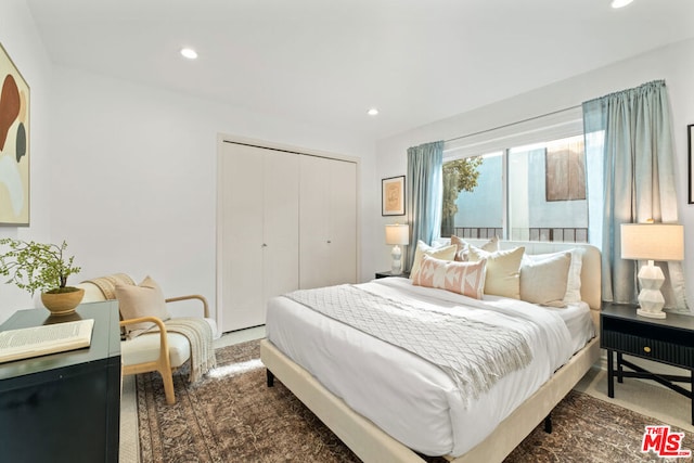 carpeted bedroom with a closet