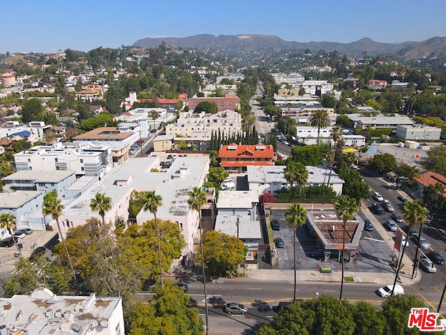 birds eye view of property featuring a mountain view