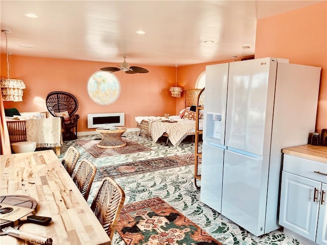 interior space with ceiling fan