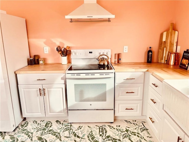 kitchen with white cabinetry, light tile patterned floors, white appliances, and exhaust hood