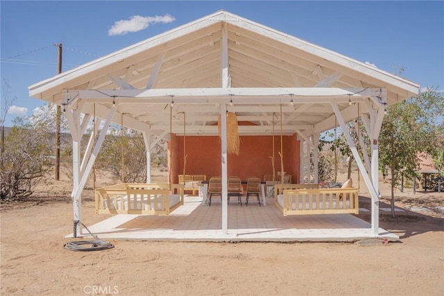 surrounding community with a gazebo and outdoor lounge area