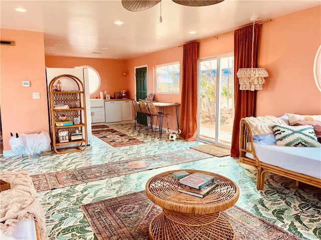 living area featuring ceiling fan