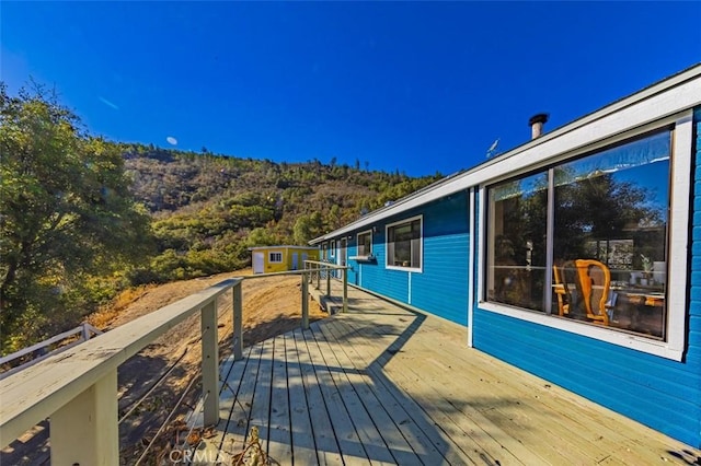 deck featuring an outbuilding