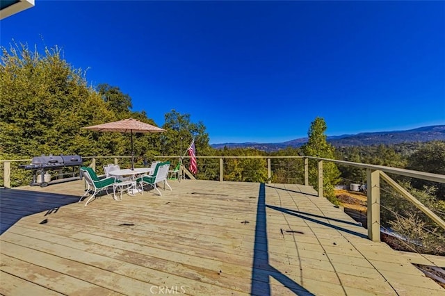 exterior space with a mountain view and a grill