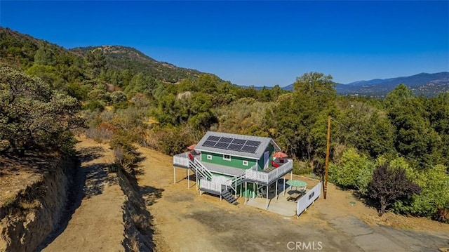 birds eye view of property featuring a mountain view