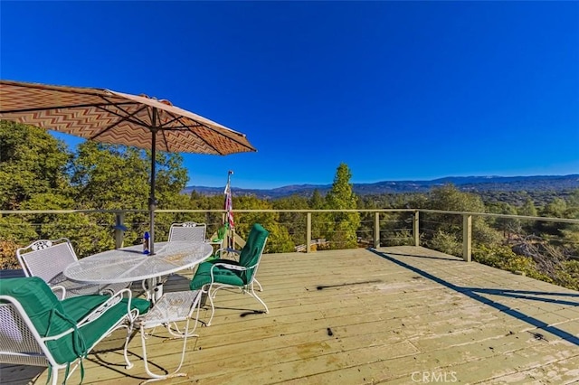 wooden deck featuring a mountain view