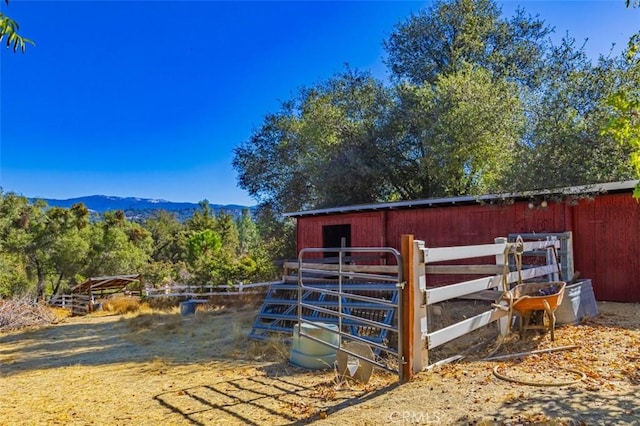 view of outbuilding with a mountain view