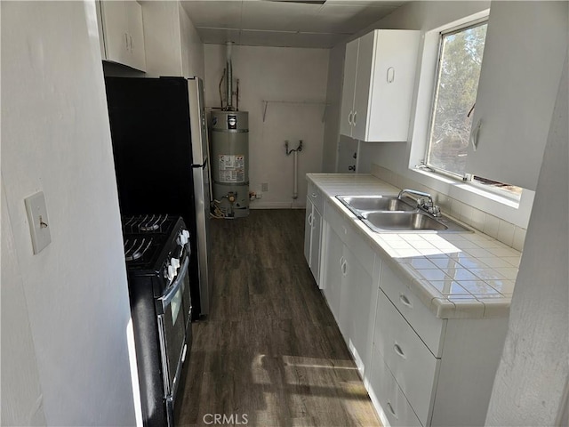 kitchen with white cabinetry, dark hardwood / wood-style floors, stainless steel range oven, strapped water heater, and sink