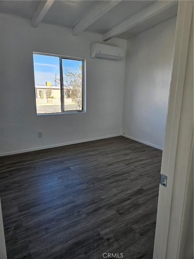 empty room with dark hardwood / wood-style flooring, beam ceiling, and an AC wall unit