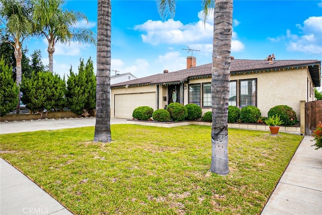 single story home with a garage and a front lawn