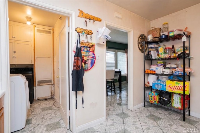 interior space featuring cabinets and washer / clothes dryer