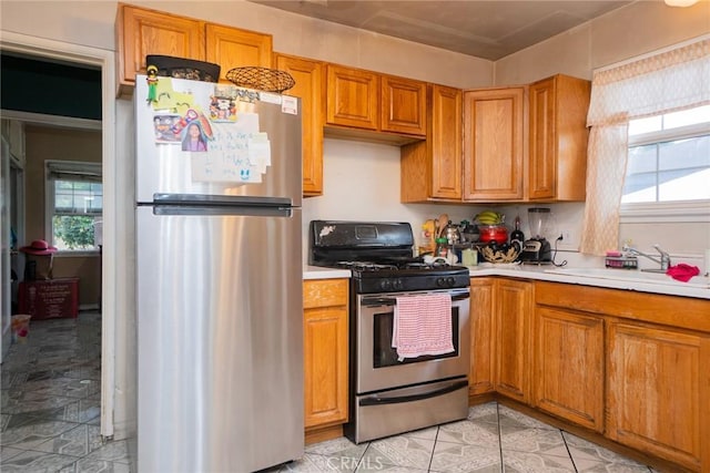 kitchen featuring sink, plenty of natural light, and appliances with stainless steel finishes