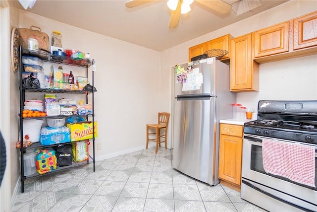 kitchen with ceiling fan, light tile patterned flooring, stainless steel appliances, and light brown cabinets