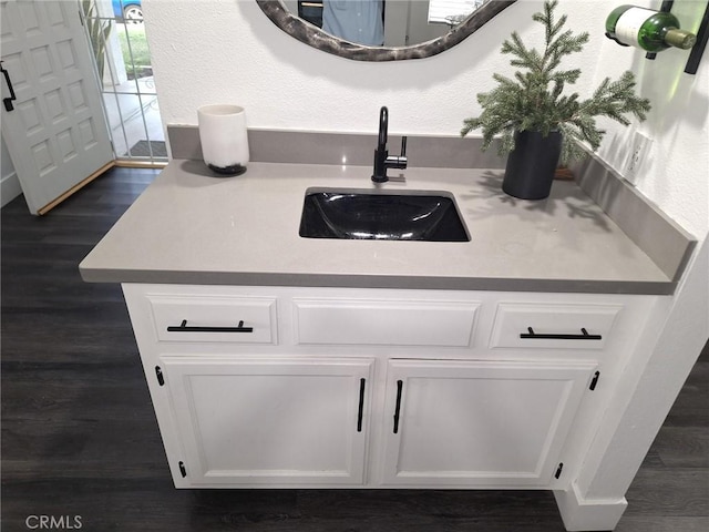 bathroom featuring hardwood / wood-style floors and vanity