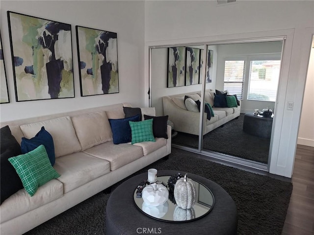 living room featuring dark hardwood / wood-style flooring