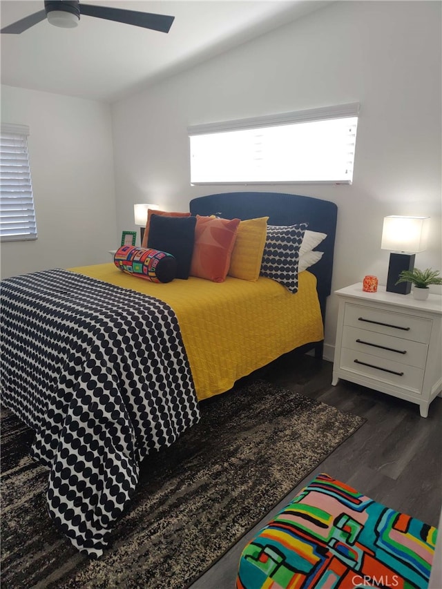 bedroom with ceiling fan and dark hardwood / wood-style floors