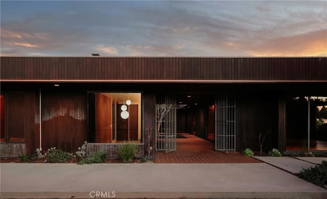 view of exterior entry at dusk