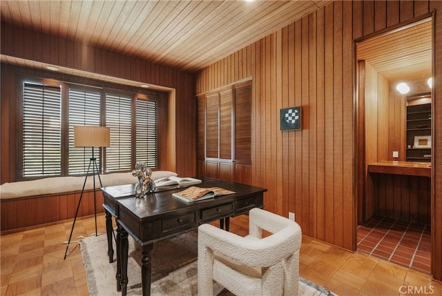 office featuring wooden ceiling, wooden walls, and light parquet floors