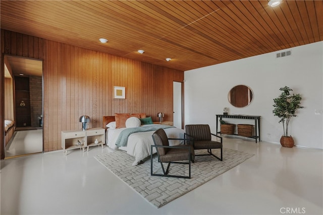 bedroom with wood walls and wood ceiling