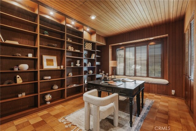 office featuring wood walls, wood ceiling, and parquet flooring