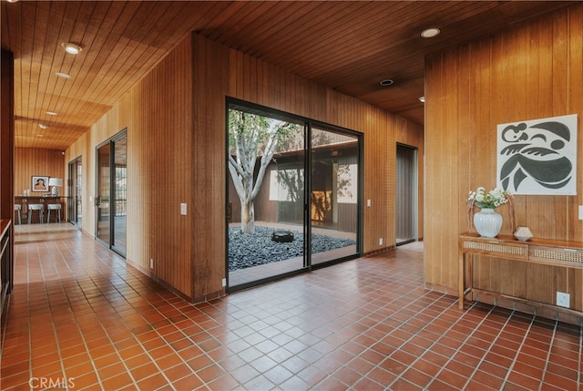 interior space with wooden walls and wood ceiling