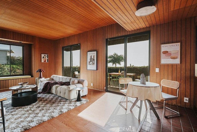 sunroom / solarium featuring wooden ceiling and a healthy amount of sunlight