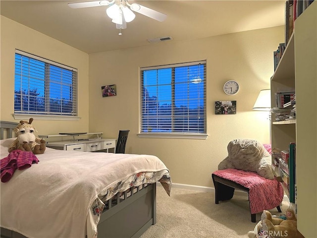 bedroom with light colored carpet and ceiling fan