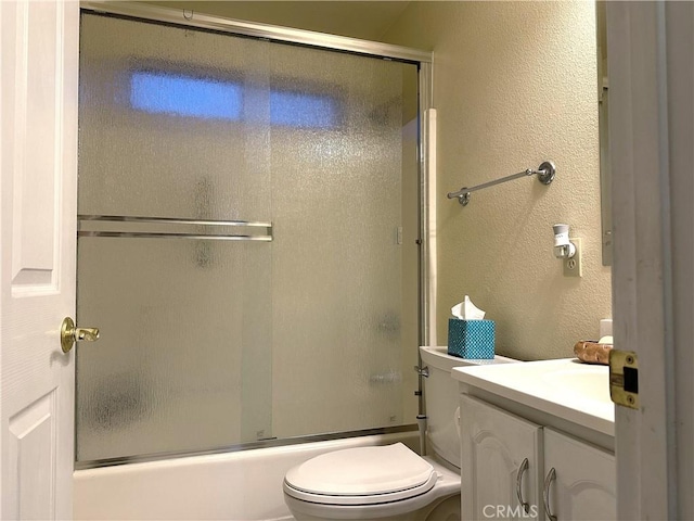 full bathroom with shower / bath combination with glass door, vanity, and toilet