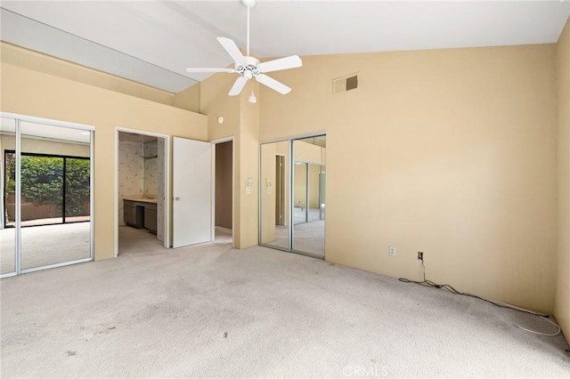 unfurnished bedroom with ceiling fan, light colored carpet, access to outside, and high vaulted ceiling