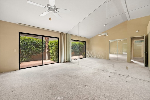 spare room with carpet floors, high vaulted ceiling, and ceiling fan