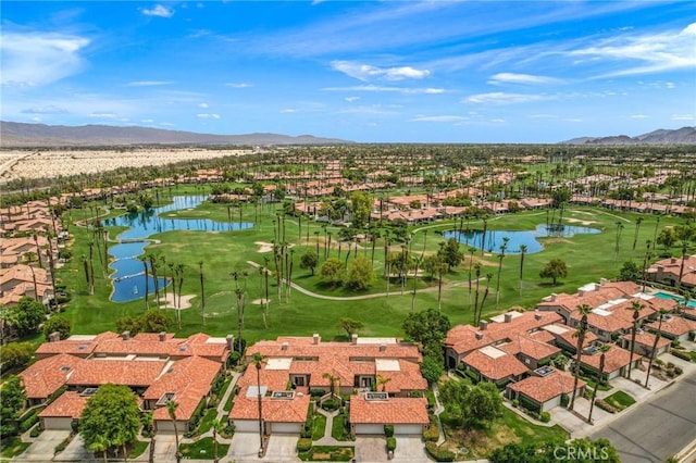 drone / aerial view with a water and mountain view