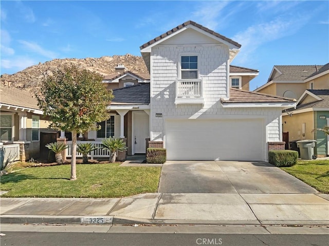 view of front of house with a front yard and a garage