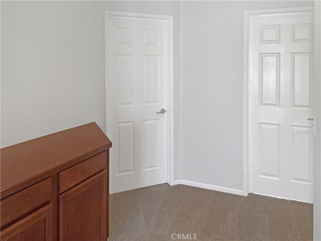 unfurnished bedroom with light colored carpet