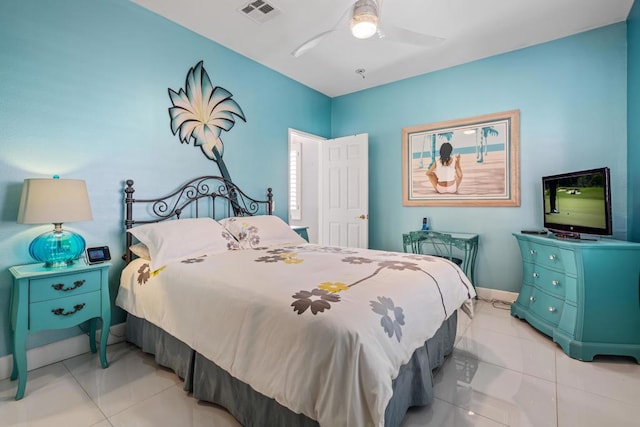 tiled bedroom featuring ceiling fan